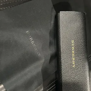 Burberry Black Case with Gold Logo includes Burberry cleaning cloth. thumbnail 2
