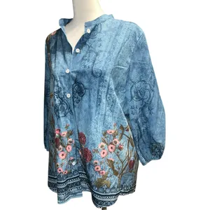 Blue faded look top with floral design. thumbnail 2