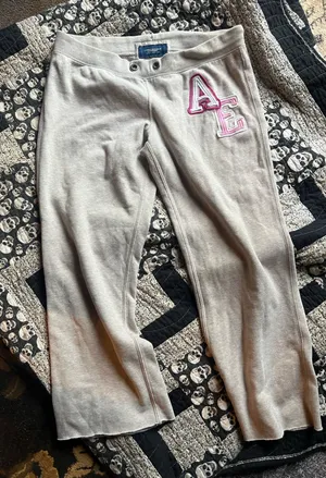 American Eagle Outfitters Light Gray Track Pants with Pink AE Patch thumbnail 1