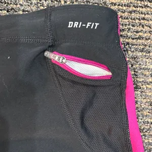 Nike Women’s Large DriFit Black with Pink Trim Capris thumbnail 6
