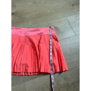 EUC Women Lululemon Pleat To Street Skirt II Grapefruit neon tennis skirt Size 8 thumbnail 6