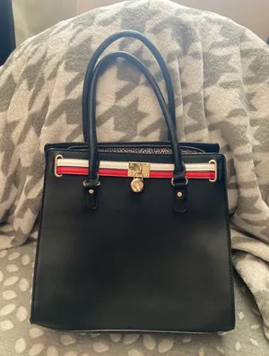 Black handbag/crossbody with red and white stipe Cheetah print interior design Plenty of zippers thumbnail 1