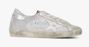 GOLDEN GOOSE Super-Star Iridescent and Glitter Leather Sneakers - Sz 38 - US 7 1/2 These are in good condition with light wear throughout. They are a pretty hard to find but super cute style. They have like holographic leather and glitter areas. Please see pics for details. Metallic leather upper Round toe Lace-up closure White leather star Cushioned insole; unlined Rubber sole Made in Italy thumbnail 1