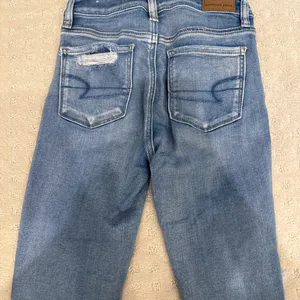 American Eagle Next Level Stretch Distressed Skinny Jeans Light Wash Size 0 thumbnail 6