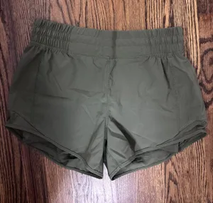 Olive green athletic shorts with spandex thumbnail 1