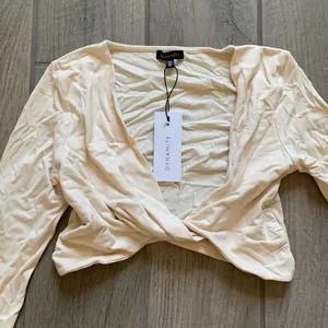 Dynamite haut long sleeve micro wrap top in birch thumbnail 2