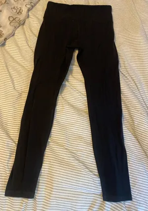 Athleta Ultra High Rise Black Leggings size M, ok condition, pet friendly home thumbnail 1