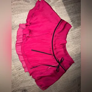 Urban Outfitters Pink mini skirt with black ribbon detail thumbnail 1