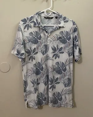 TravisMathew White Polo with Blue Tropical Leaf Print thumbnail 1