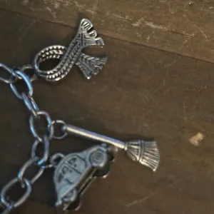Silver tone charm bracelet with assorted charms thumbnail 3