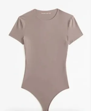 Abercrombie | Seamless Cotton-Blend Short Sleeve Thong Bodysuit in Tan thumbnail 1