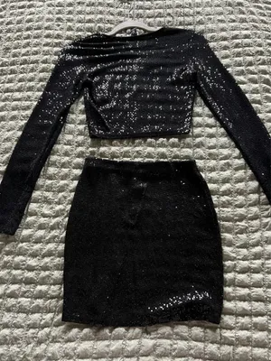 Windsor Black sequin two-piece skirt set with long-sleeve crop top and matching skirt. Sleek, sparkly fabric creates standout evening style. Comfortable fit with a polished, modern silhouette. Perfect for parties and special occasions. thumbnail 5