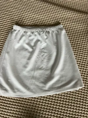 White mini skirt with subtle textured pattern, size S. Polyester & spandex blend. #mini #textured thumbnail 2