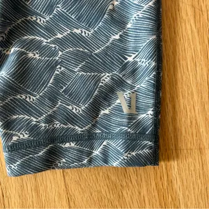 Vuori Pace High Rise Printed Leggings in Navy Wave blue crop size large thumbnail 5