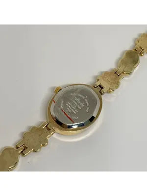 Allude gold tone women’s watch red stones 19mm floral links up to 7.5” running thumbnail 6