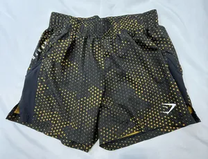 Gymshark Black Shorts with Gold Triangle Print thumbnail 1