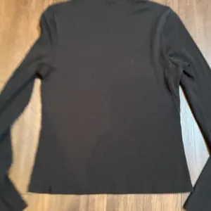 Lululemon Ribbed Wool Blend Turtleneck Long Sleeve Top Black Size 8 Athleisure thumbnail 1