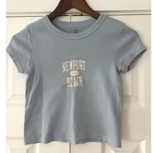 Brandy Melville Newport Beach 1984 Baby Tee Light Blue Cotton Graphic Crop Top thumbnail 1