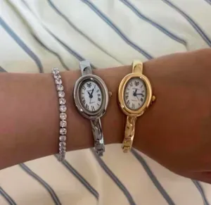 Brand New y2k style gold bangle watch with white face and Roman numerals thumbnail 4