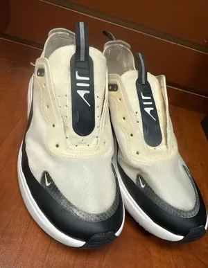 Nike Cream, Black & White Slip-On Athletic Sneakers thumbnail 1