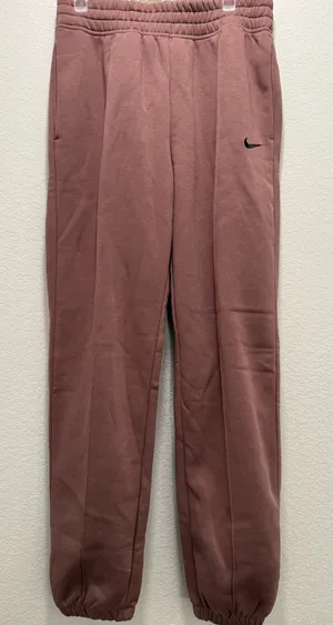 Pink Nike sweatpants with black logo thumbnail 1