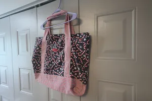 Mia and Tess candy cane and snowflake Christmas tote in black, red and white. thumbnail 2