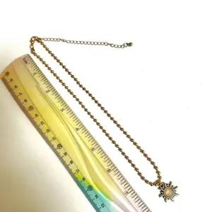 Gold tone sun pendant necklace thumbnail 5