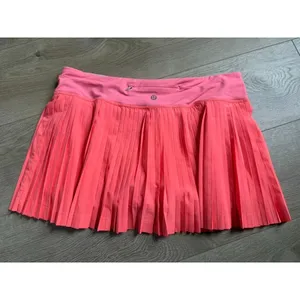 EUC Women Lululemon Pleat To Street Skirt II Grapefruit neon tennis skirt Size 8 thumbnail 2