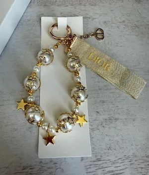 Dior NIB VIP Pearl Gold Star Holiday Bag Charm thumbnail 1
