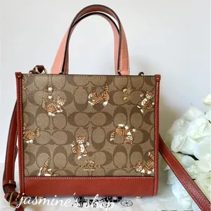 Coach Dempsey Tote 22 In Signature Canvas With Dancing Kitten Print thumbnail 1