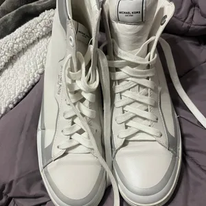Michael kors boits. Never worn. See photos for peeling thumbnail 2