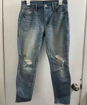 GAP “True Skinny” Distressed jeans. Size 8 has two spots in the front leg thumbnail 1