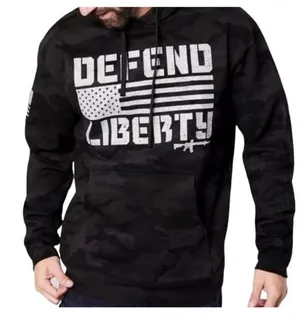 Howitzer "Defend Liberty" Black Camo Hoodie Elevate your casual wear with this rugged and patriotic Howitzer "Defend Liberty" Hoodie. Featuring a stealthy black multicam (camo) pattern, this hoodie is designed for those who value both style and a strong message of freedom. Constructed with high-quality, durable fabric, it offers a comfortable fit perfect for outdoor adventures, range days, or daily wear. Product Features: • Brand: Howitzer Manufacturing Co. • Design: Bold "DEFEND LIBERTY" distressed graphic with the American flag and an AR-15 silhouette on the front. • Back Detail: A vertical "DEFEND LIBERTY" spine graphic for a unique look from every angle. • Sleeve Detail: Features the Howitzer brand American flag patch on the sleeve. • Pattern: Modern black/dark grey camouflage. • Style: Pullover with adjustable drawstring hood and a spacious kangaroo front pocket. thumbnail 3