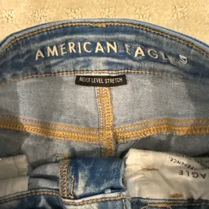 American Eagle Next Level Stretch Distressed Skinny Jeans Light Wash Size 0 thumbnail 4
