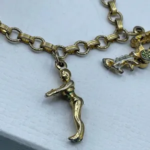 Vintage 6” charm bracelet. Gold tone with crossover clasp. thumbnail 2