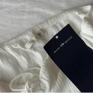 brandy melville white flowy babydoll top thumbnail 3