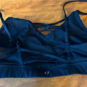 Strappy Black Sports Bra with Crisscross Detail size Medium like new thumbnail 1