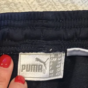 Puma Women’s Wide Leg Black & Gold Athletic Pants - Size M thumbnail 4