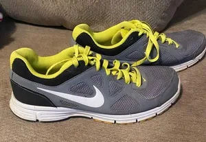 Nike women's Revolution Grey/Yellow Running Shoes. 9 thumbnail 1