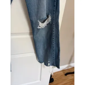 Petra 153 jeans w/ heavy knee destruction, whiskering, and a raw frayed hemline thumbnail 3