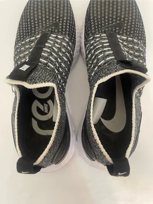 Nike Women’s Black and White Slip-On Knit Sneakers thumbnail 5