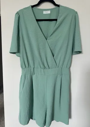 Style Haven Boutique Green Textured V-Neck Short Sleeve Romper with Pockets Size thumbnail 1