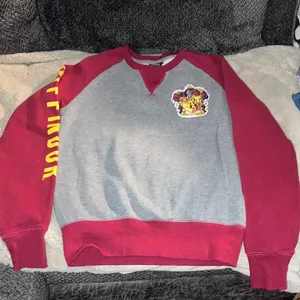 The Wizarding World of Harry Potter Gryffindor Sweatshirt, XS thumbnail 1