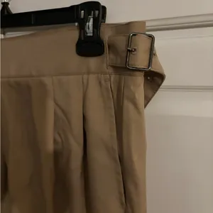 Timeless form tan‎ pants. Buckles on waist. thumbnail 2