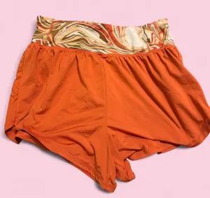 Orange and multi-coloured swirl print shorts with elastic waistband and drawstring thumbnail 1