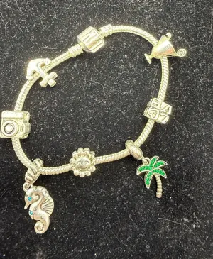Silver-Tone Charm Bracelet with Beach and Travel Themed Charms thumbnail 1