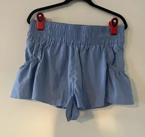 Free People Movement Blue High Rise Athletic Shorts Large Ruffle Side Pockets thumbnail 1