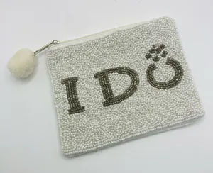 Shirdee white and silver “I do” beaded zippered pouch with pom. thumbnail 1