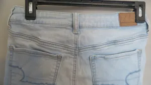 American Eagle Outfitters next level stretch hi-rise shortie jeans in light wash blue size 6. thumbnail 6