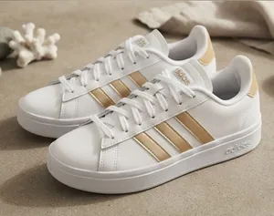 adidas White Sneakers with Gold Stripes thumbnail 1